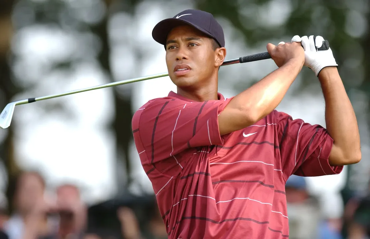 Tiger Woods mid-swing — he trained with a hypnotherapist starting at age 13